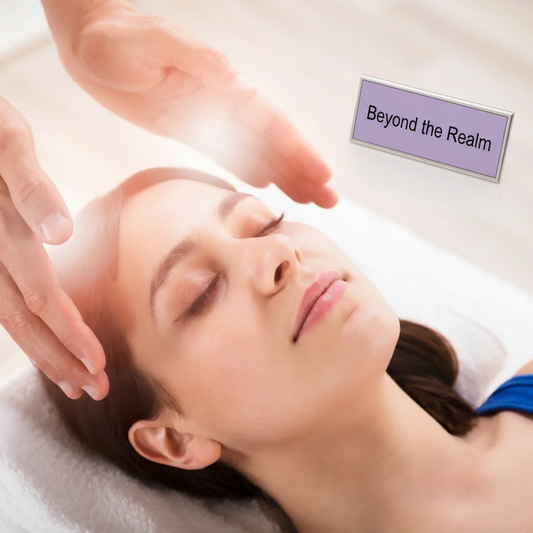 Person receiving Reiki on the crown chakra at Beyond the Realm in Manchester, NH